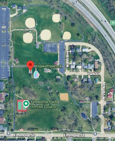 Aerial view of the park, bounded by Emmons Street to the south, showing the open parkland and ball diamonds the course runs through.